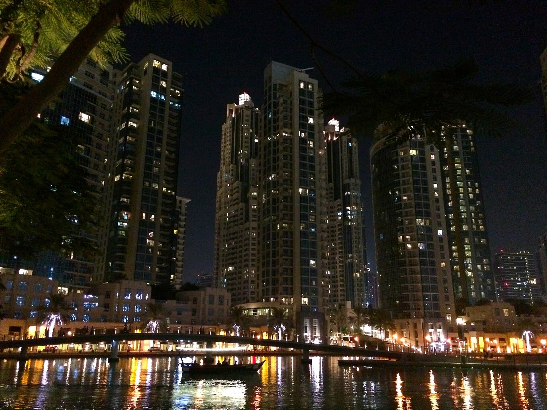 The Residences towers in Downtown Dubai at night, seen across Burj Khalifa Lake
